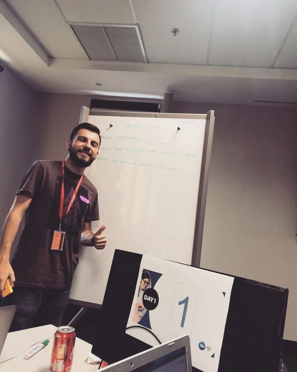 Me giving a thumbs-up next to a whiteboard with memory-usage notes on day 1 of the P&G IT Hackathon