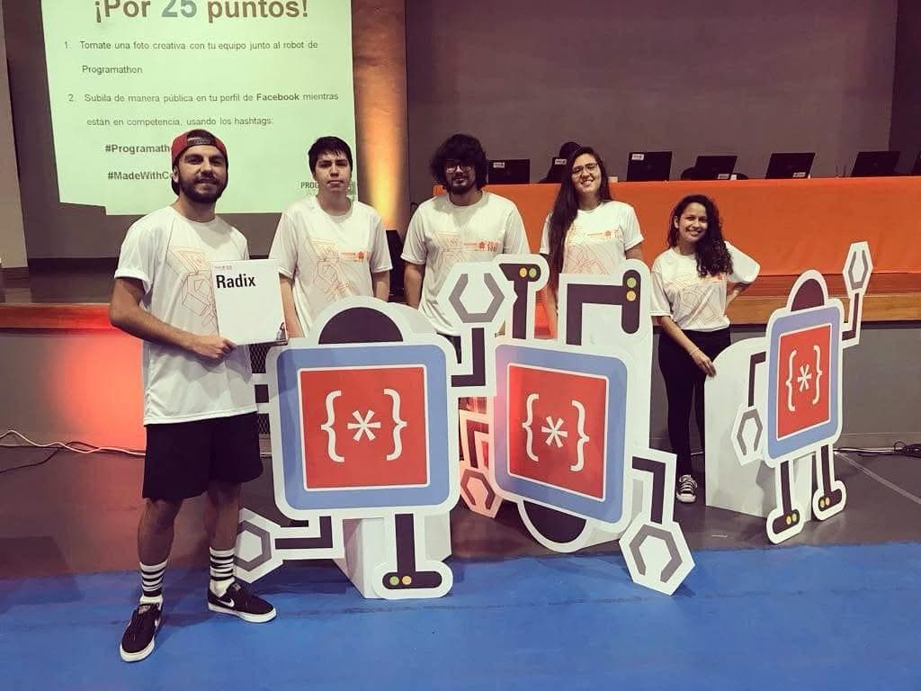 Team Radix posing with the Programathon robot cut-outs on stage