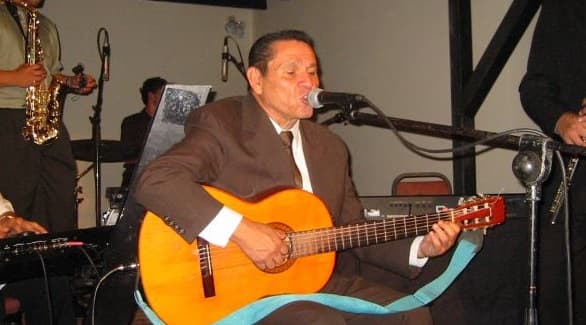 Lalo Rojas playing the guitar